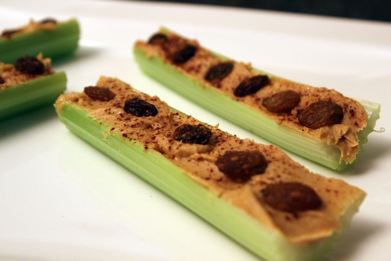close up of ants on a celery stick