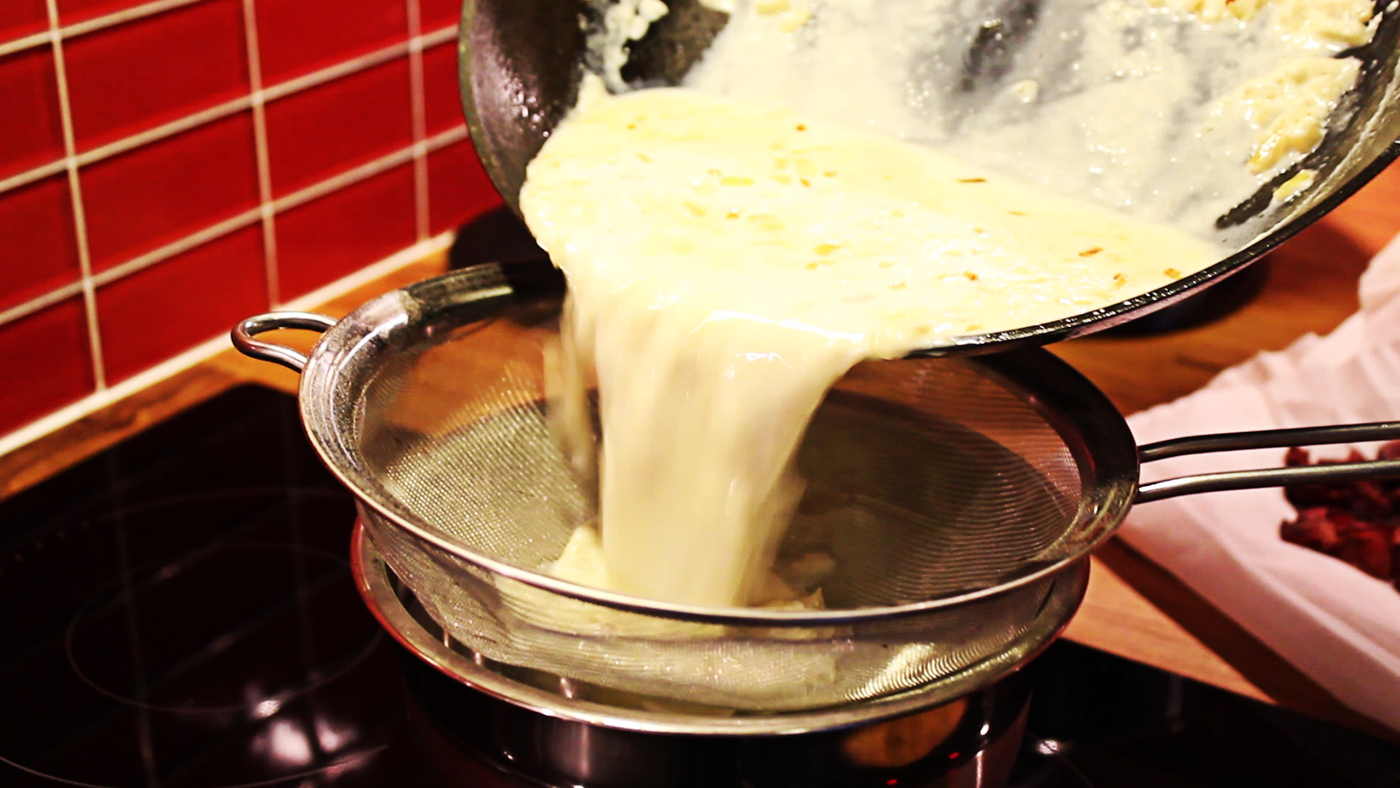 Sieve the cream infused with caramelized onions