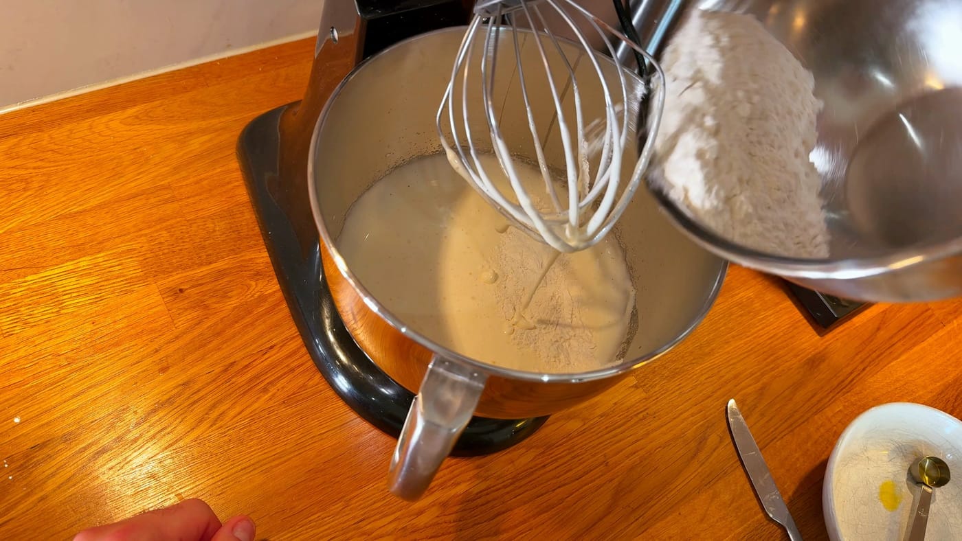 The flour mix going into the whipped eggs